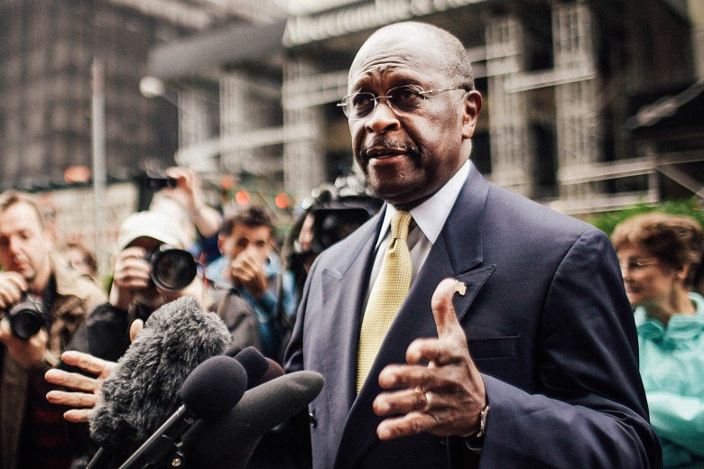 Herman Cain speaks to the media outside of Trump Tower before a scheduled appearance with real estate mogul Donald Trump on Oct. 3, 2011 in New York City.